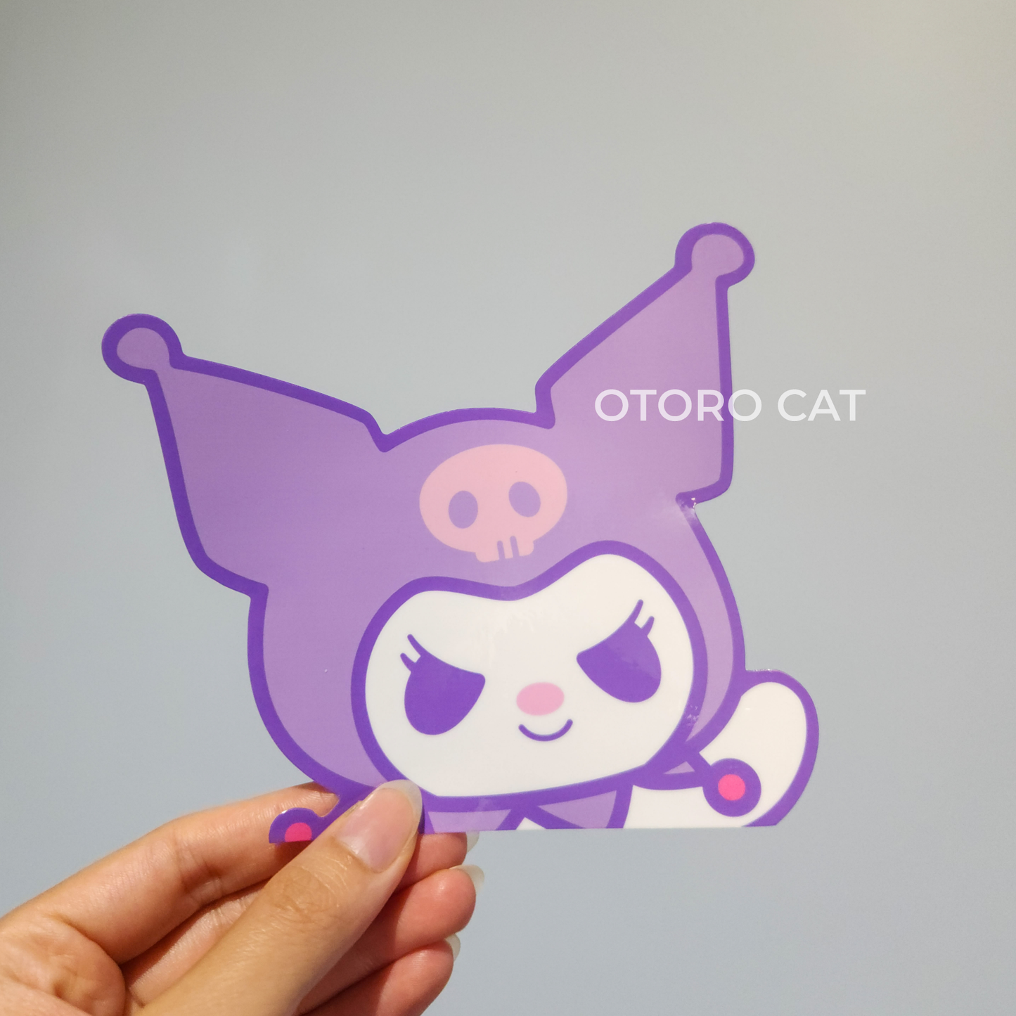 Elevate Your Style with the Purple Kuro Peeker Sticker - Perfect for E-Readers and Cars!